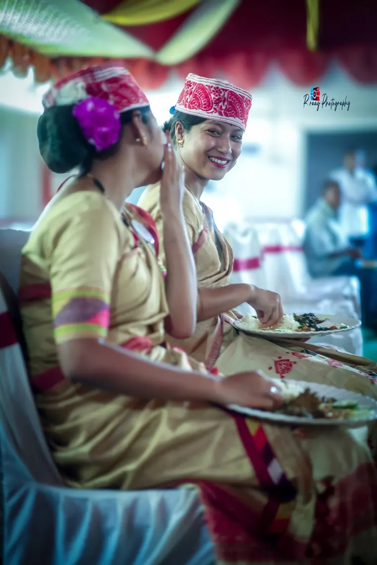Two women in mekhela chador during the feast