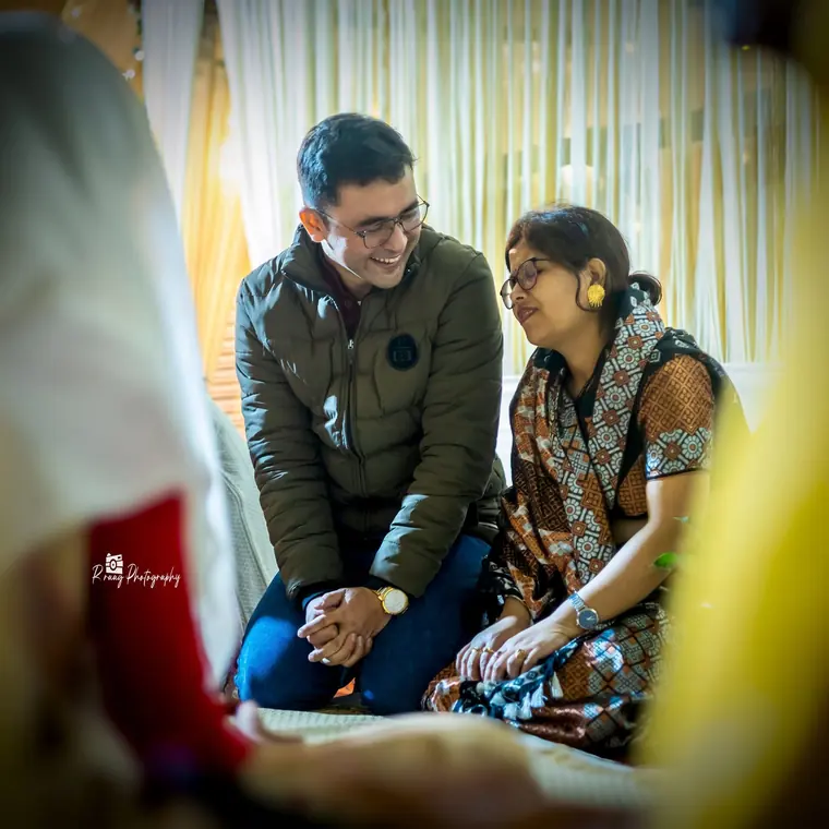 Couple sharing a quiet moment away from the crowd