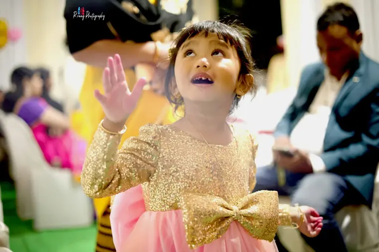 Little girl in a gold party dress