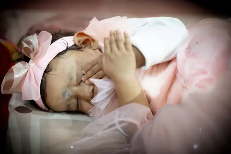 Newborn asleep in soft light