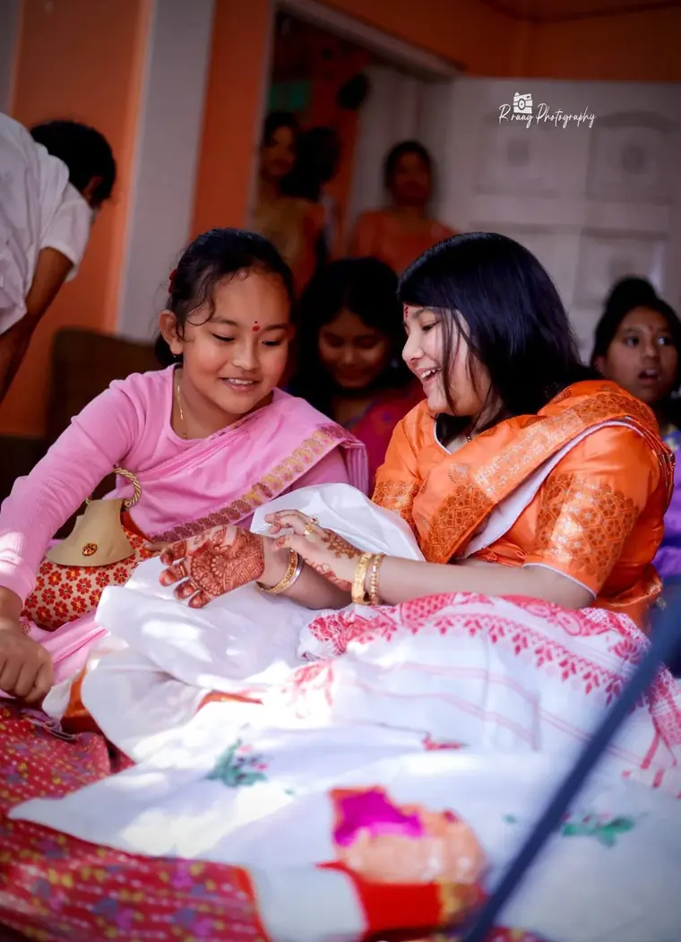 Sisters meeting the newborn
