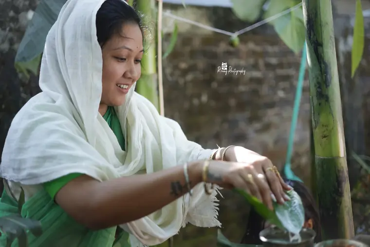 Ritual water poured at the tulsi