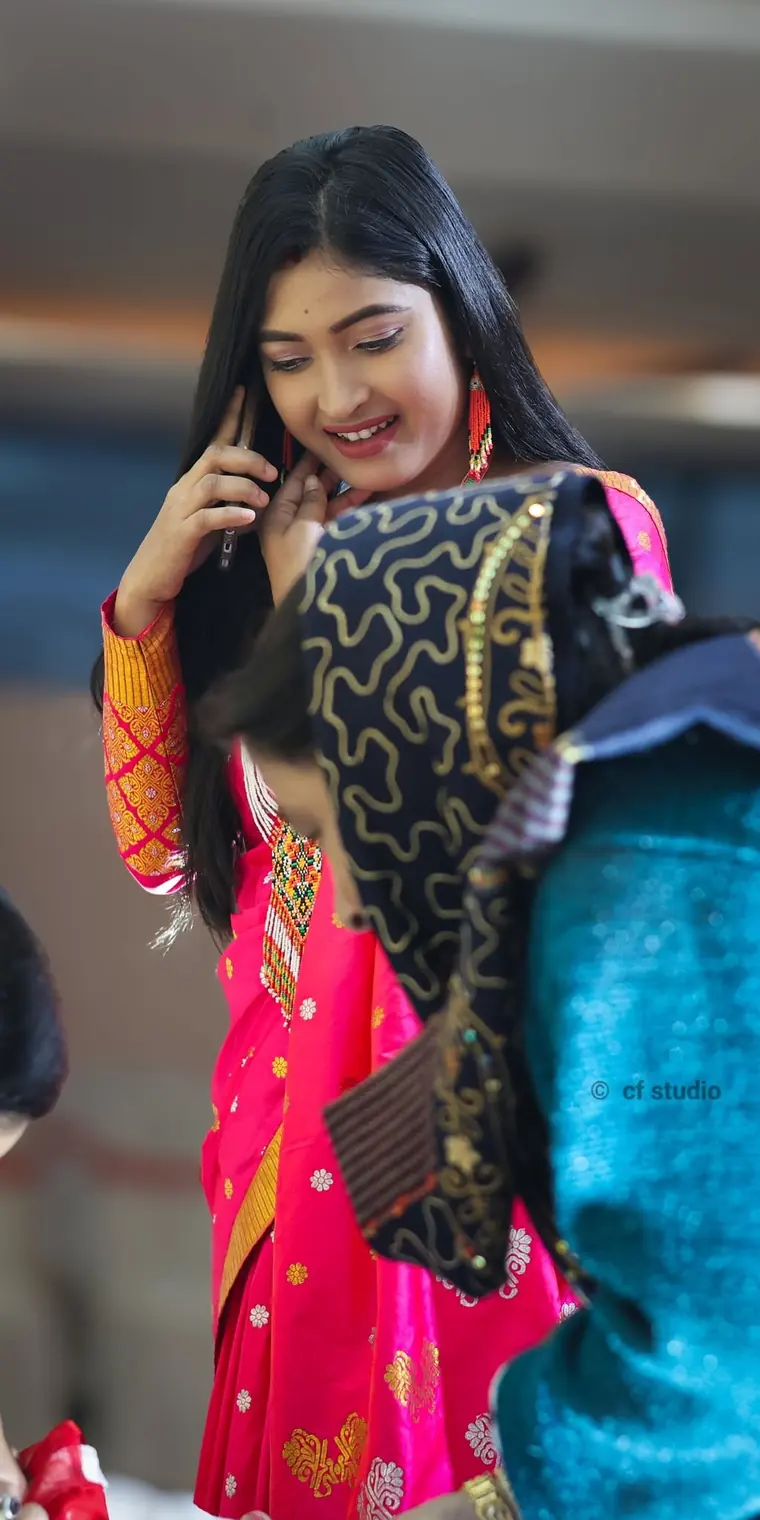 Girl caught mid-laugh at a family function