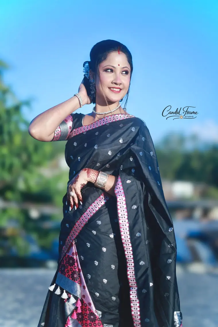 Black saree portrait by the river